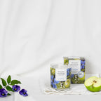 Apple and lily candle with box.