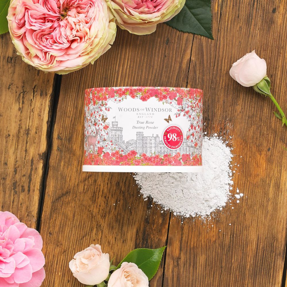 Layflat with roses and talcum powder box.