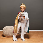Kid holding cuddly toys.