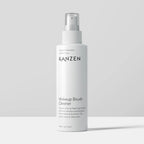 Spray bottle for liquid that removes residue and bacteria from makeup brushes.