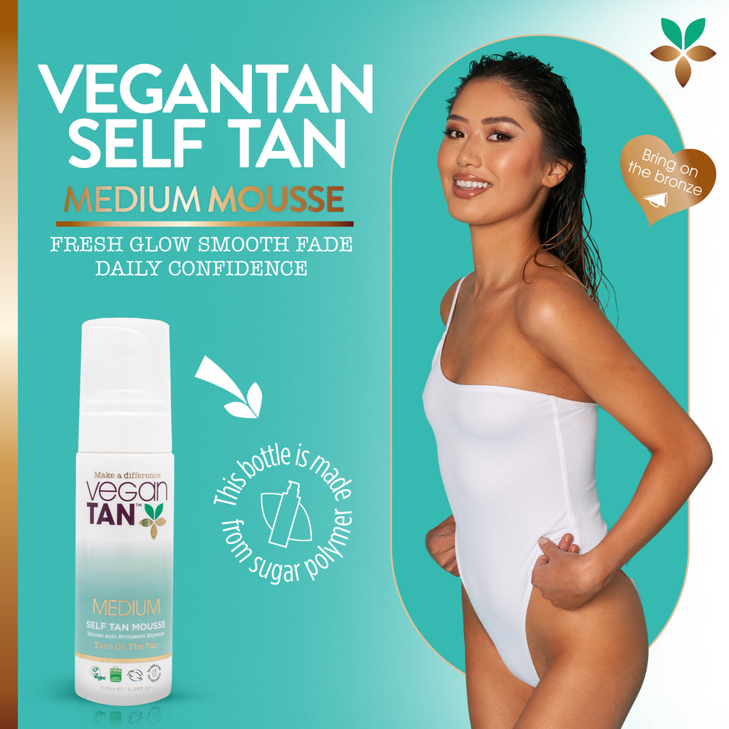 Vegan Tan Medium Mousse self tan product shown in a white spray bottle on the left, alongside a smiling woman in a white bodysuit on the right, over a teal promotional background with text and badge graphics.
