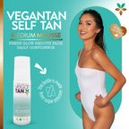 Vegan Tan Medium Mousse self tan product shown in a white spray bottle on the left, alongside a smiling woman in a white bodysuit on the right, over a teal promotional background with text and badge graphics.