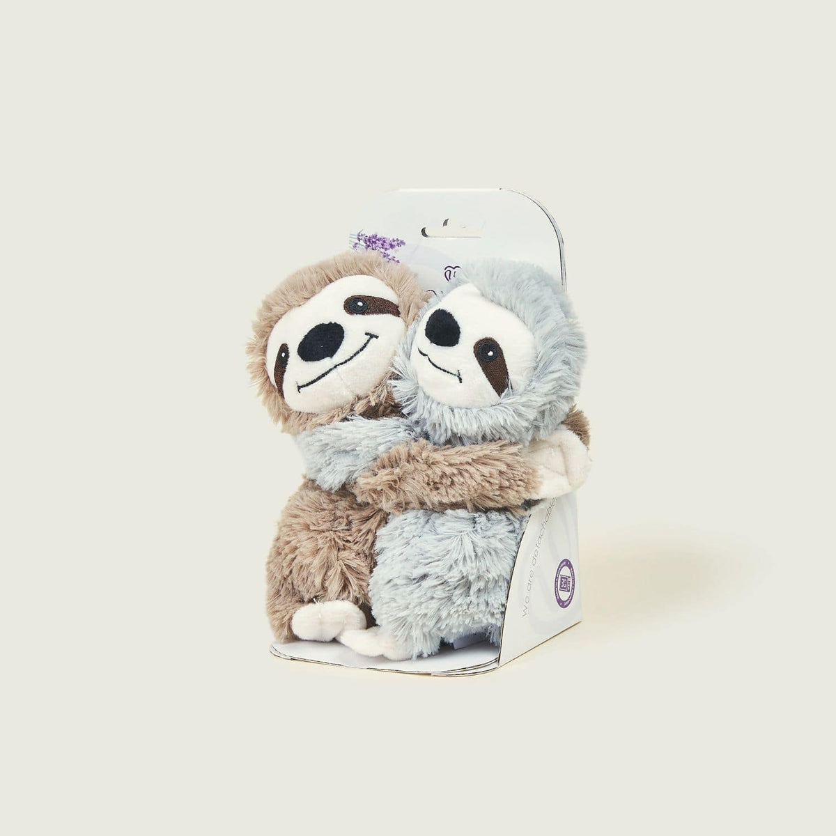 Pair of small sloths with packaging.