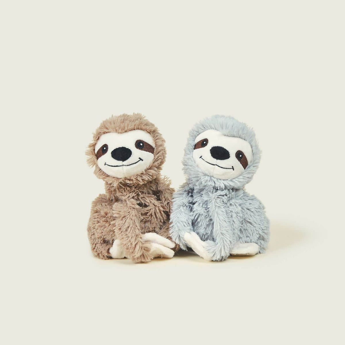 Pair of smily cuddly toys.