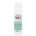 white bottled tanning product on white background