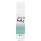 white bottled tanning product on white background